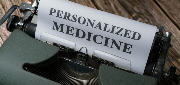 a typewriter with a paper that reads personalized medicine